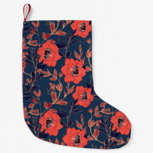 Rode bloemen van rozen en pinda's met bladeren en kleine kerstsok