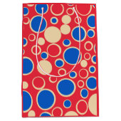 Rode en blauwe Stippen op rood Medium Cadeauzakje (Voorkant)