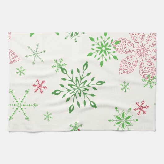 Rode en groene sneeuwvlokken op een witte achtergr theedoek (Horizontaal)