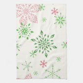 Rode en groene sneeuwvlokken op een witte achtergr theedoek (Verticaal)