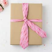 Rode en witte bonbons op roze stropdas