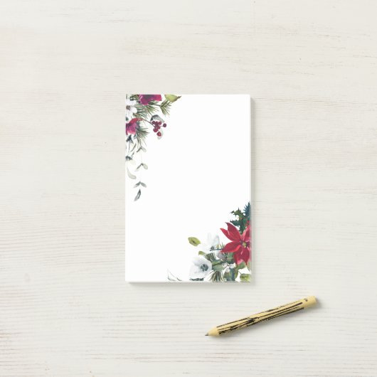 Rode en witte kerstbloemen post-it® notes (Op bureau)