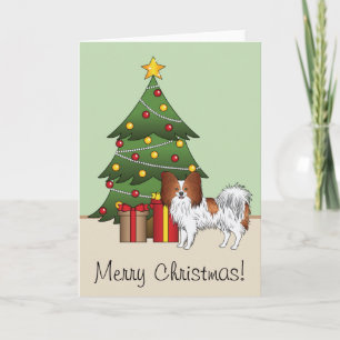 Rode En Witte Papillon Hond Bij Een Kerstboom Kaart