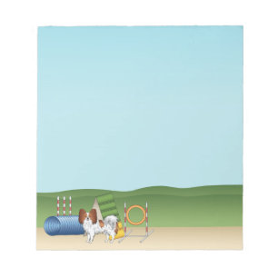 Rode En Witte Papillon Met Agility Apparatuur Notitieblok