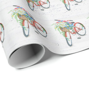 Rode fiets met een ventilatormandje cadeaupapier