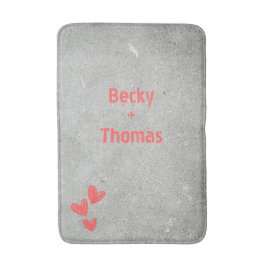 Rode graffiti naam op grijs beton, uw badmat