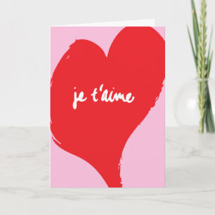 Rode hart met je t’aime-tekst op roze achtergrond kaart