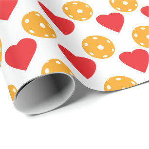 Rode harten en oranje pekelballen cadeaupapier