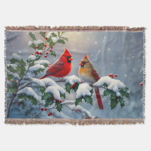 Rode kardinalen en hulst in de sneeuw deken