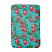 Rode kersen op turquoise badmat (Voorkant Verticaal)