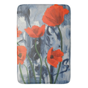 Rode papaver op grijs badmat