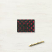 Rode polka kruist zwart post-it® notes (Op bureau)