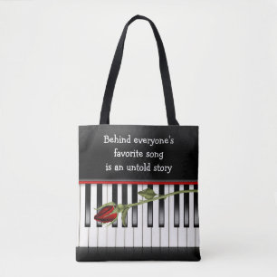 rode roos op pianotoetsenbord tote bag