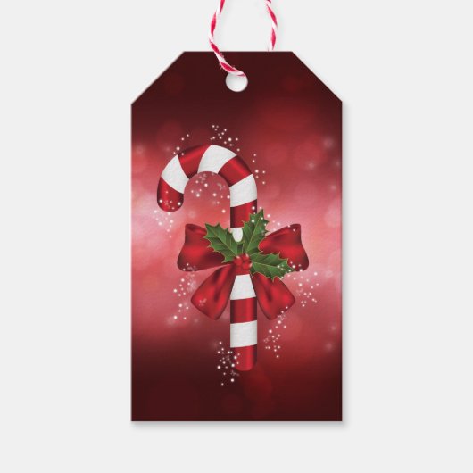 Rode snoepriet op een achtergrond van een rode keh cadeaulabel (Voorkant)