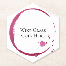 Rode wijnvlekken en druppels rond papier, onderzet