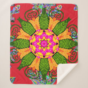 Rond bloemmandala gekleurd op een rood, groen en sherpa deken