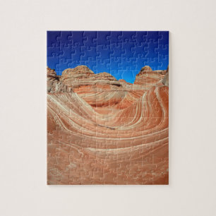 Rood, beige en geel gestreept in de wind en legpuzzel