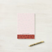 Rood bladeren patroon op sinaasappel post-it® notes (Op bureau)