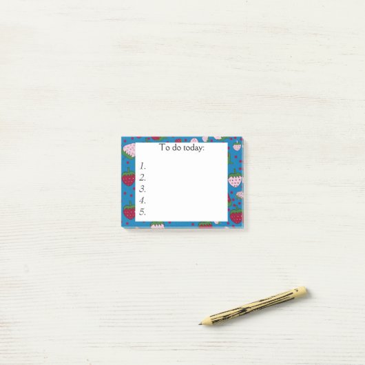 Rood en roze aardbeien op Blauwe Post Post-it® Notes (Op bureau)