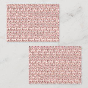 Rood en roze textiel gelegd over een pattereerde t afsprakenkaartje