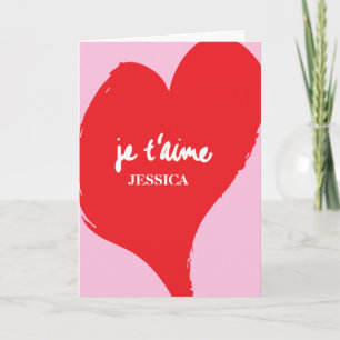 Rood hart met je t’aime-tekst op roze achtergrond kaart