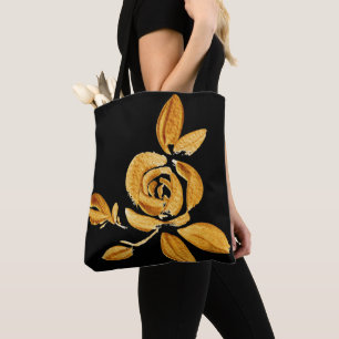 Rose dorée sur sac fourre-tout noir