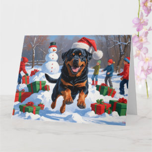Rottweiler Rent in de Sneeuw met Kerstmuts Kaart
