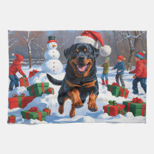 Rottweiler Rent in de Sneeuw met Kerstmuts Theedoek