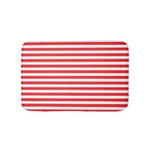 Rouge et blanc barre le tapis de bain