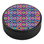 Round object with a vibrant geometric pattern hockey puck (3/4)