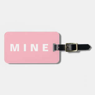 Roze bagagelabel met daarop de vermelding "Mijnbou