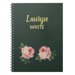 Roze bloem en bladeren op donkergroen notitieboek