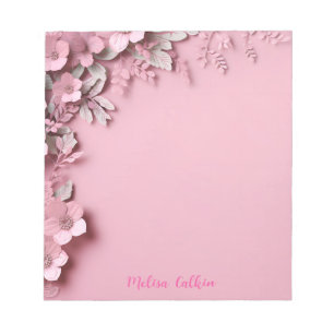 Roze bloemen decoratie met roze achtergrond notitieblok