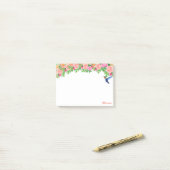 Roze bloemen, kolibrie en kalligrafie op wit post-it® notes (Op bureau)