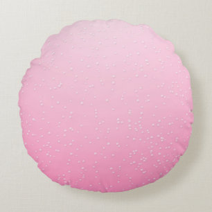Roze champagne met kleine belletjes achtergrondkun rond kussen