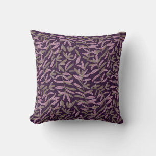 Roze en groen bladpatroon op donkere paarse achter kussen