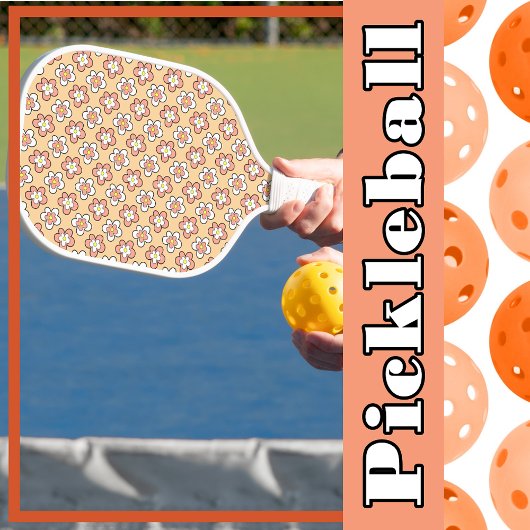 Roze en witte bloemen op perzik pickleball paddle