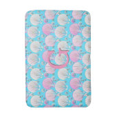 Roze en witte zeeschelpen op turquoise badmat (Voorkant Verticaal)