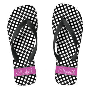 Roze en zwarte inktvlek met zwart opschrift teenslippers