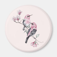 Roze en zwarte vogels op een boomtak