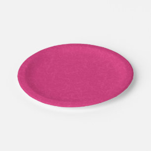 Roze gestructureerd oppervlak met subtiel draaiend papieren bordje