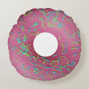 Roze ijsdonut rond kussen