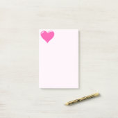 Roze stekende noot bij het hart post-it® notes (Op bureau)