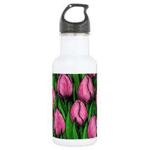 Roze tulpen met groene bladeren waterfles 
