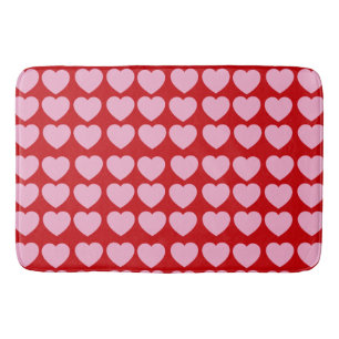 Roze Valentijnsharten op rood Badmat