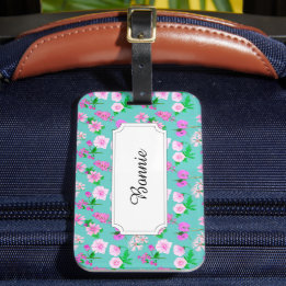 Roze veld bloemen op turquoise bagagelabel