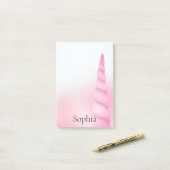 Roze witte eenhoorn post-it® notes (Op bureau)