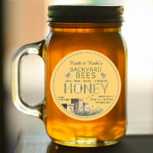 Rundbijenkorven en kleine bijen op geel ronde sticker