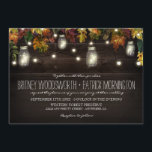 Rustic Fall Firefly Mason Jar Mariage Invitations<br><div class="desc">Rustic Fall Firefly Mason Jar Wedding Invitations - présente un arrière - plan rustique en bois de grange avec l'érable, le chêne et d'autres feuilles aux couleurs de l'automne — rouge, bordeaux, jaune, vert et orange avec des lumières clignotantes. Des jarres de Mason remplies de lumières ou de lucioles sont...</div>