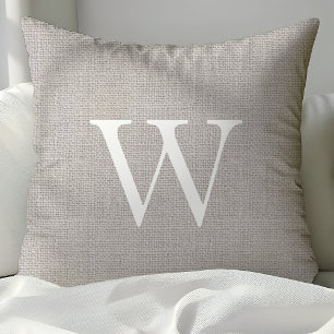 Rustige lichtgrijze jute monogram kussens